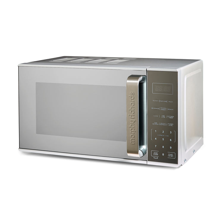 Stainless steel microwave oven on a white background