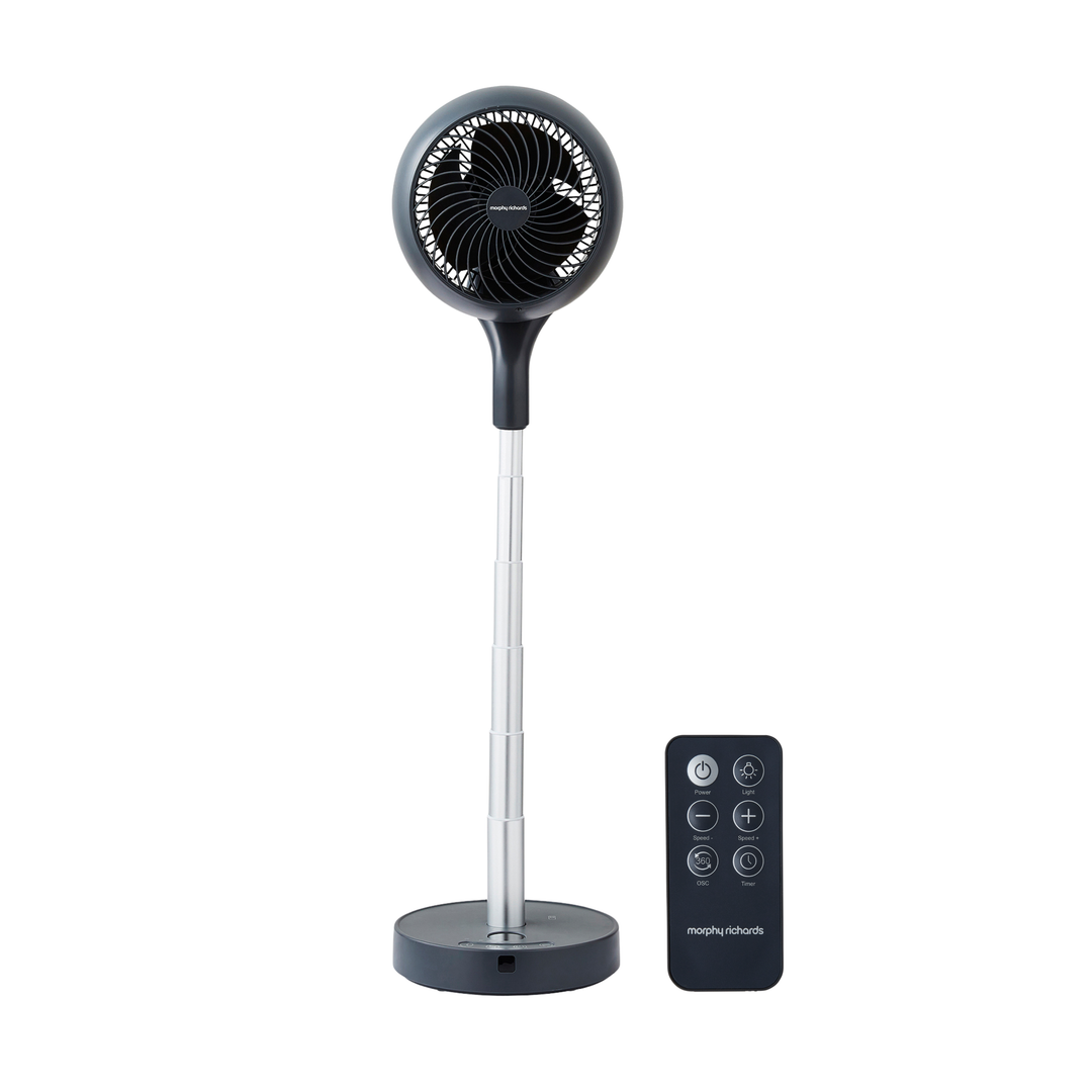 Black oscillating tower fan with remote control on a white background