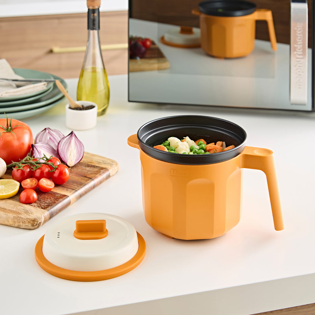Microwave Saucepan with lid off showing vegetables inside 
