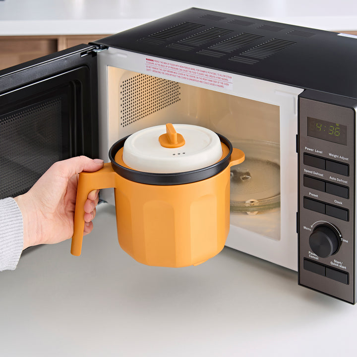 Saucepan going into the microwave 