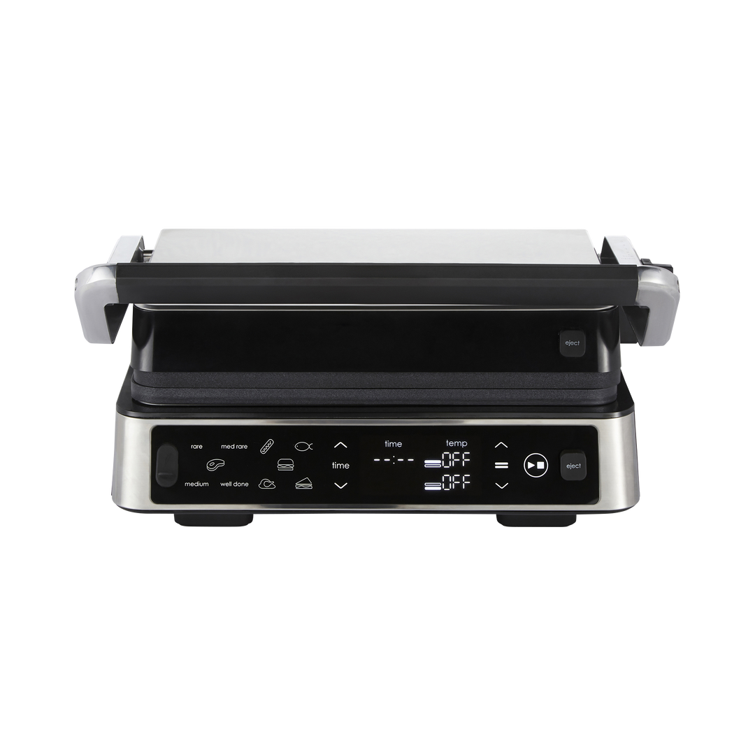 Black and silver grill with digital controls on a white background