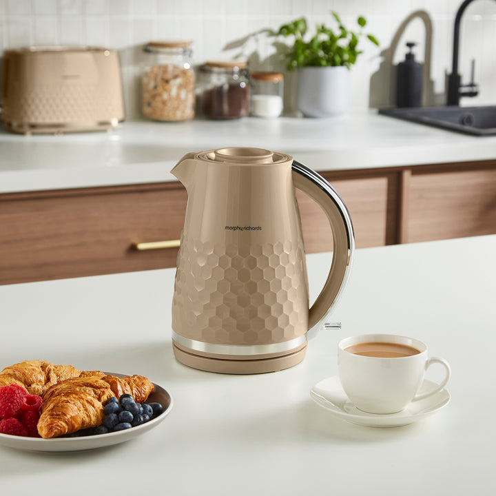 jug kettle on a kitchen counter with a toaster in the background