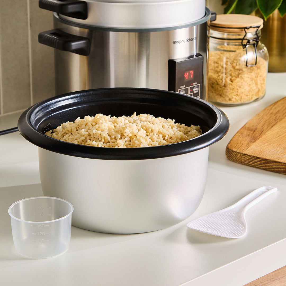 Morphy Richards rice cooker with cooked rice on a kitchen counter
