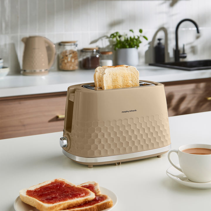 2 slice toaster on kitchen counter with matching kettle in the background