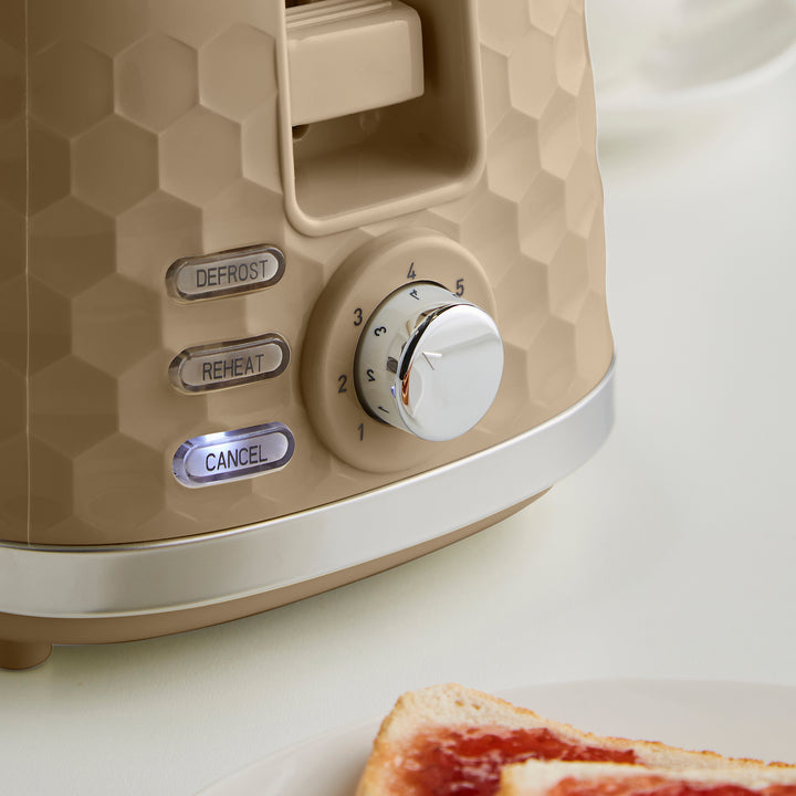pre-set functions and browning dial on a beige 2 slice toaster
