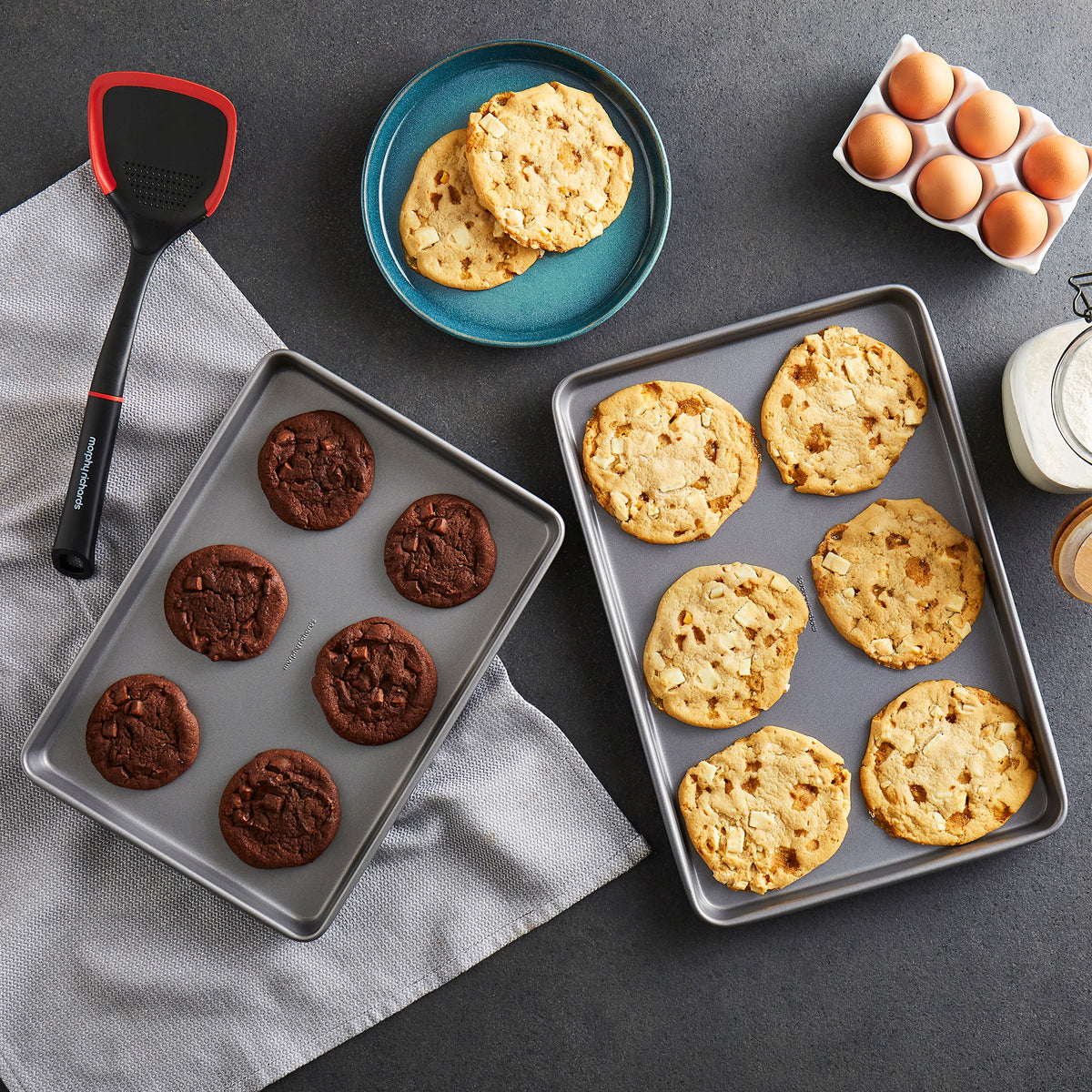 Cookies on baking tray with Spatula in the background