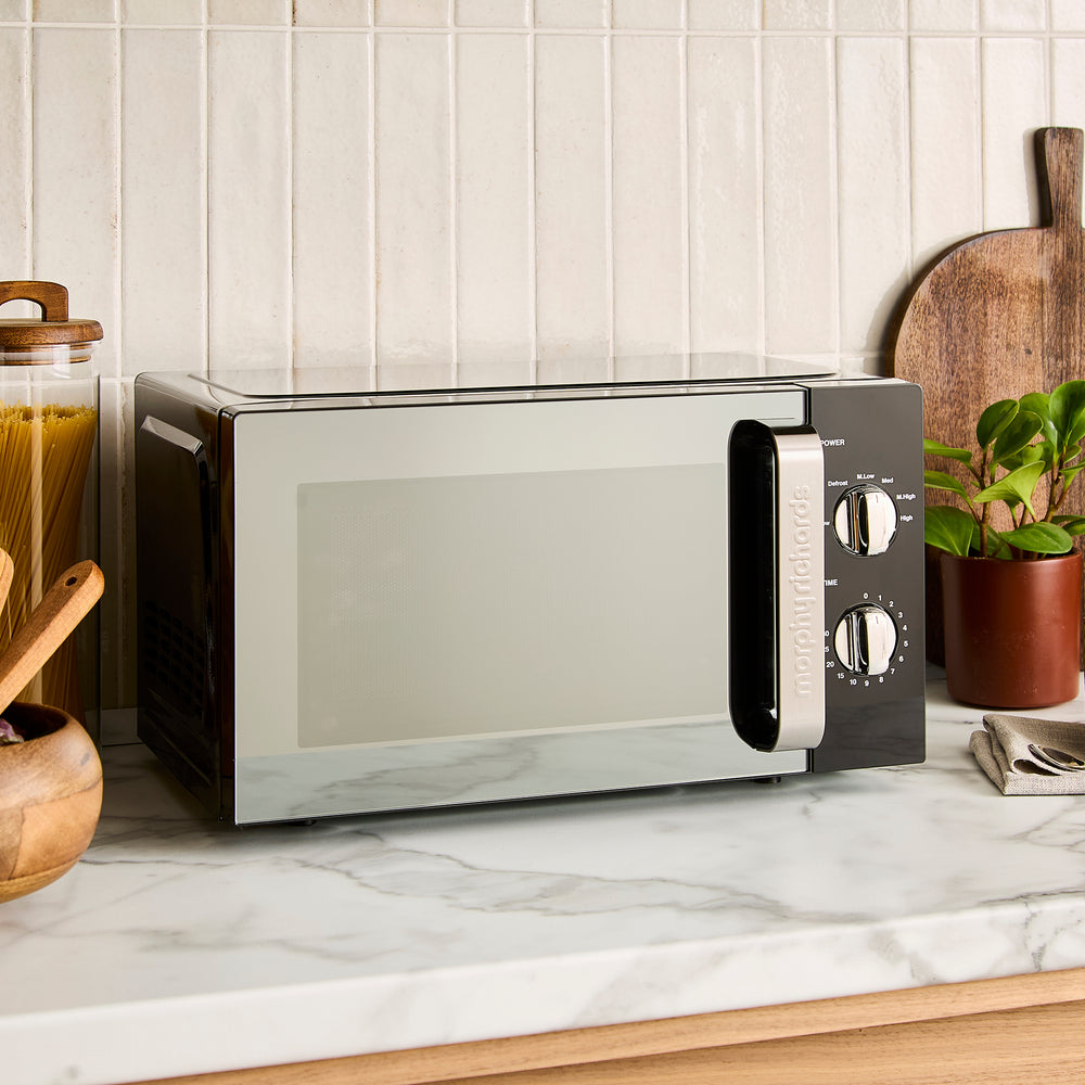 black microwave on kitchen counter