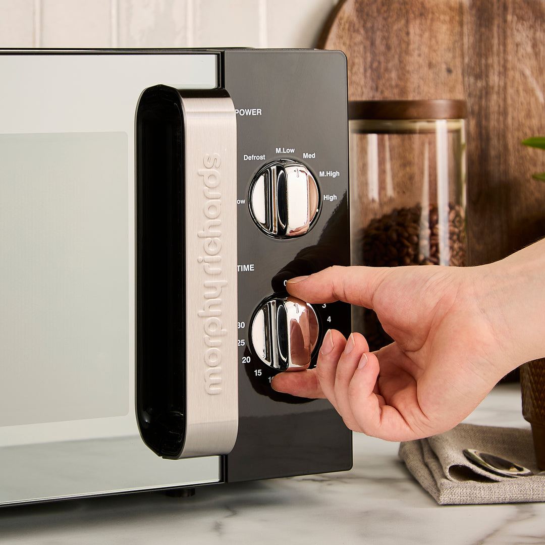 black microwave on kitchen counter