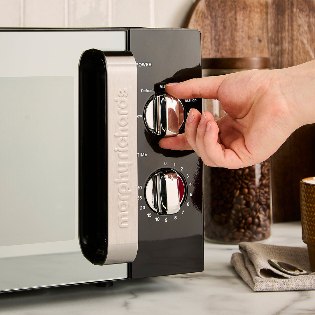 black microwave on kitchen counter