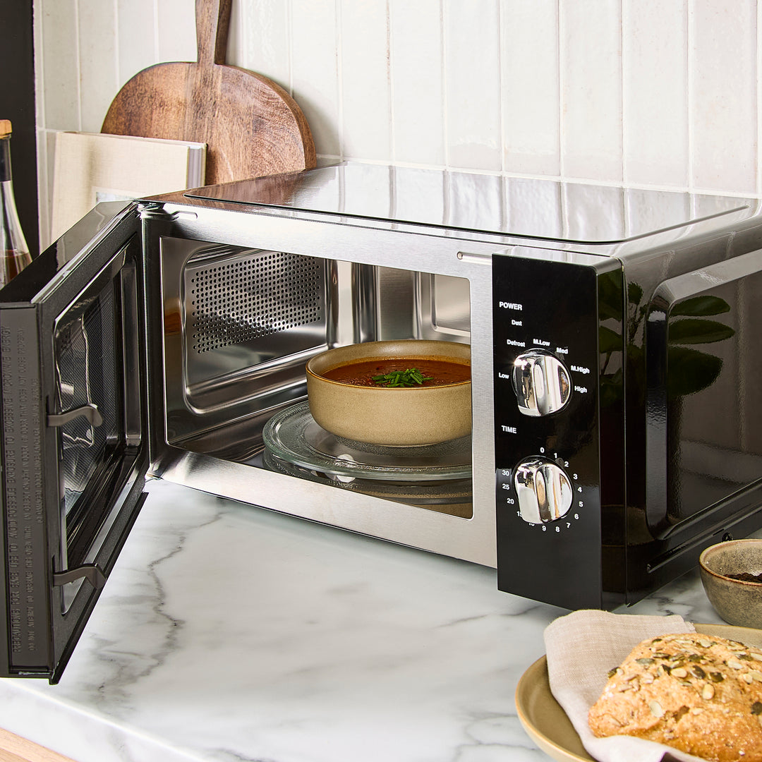 black microwave on kitchen counter