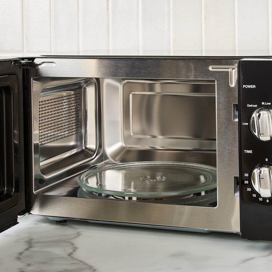 black microwave on kitchen counter