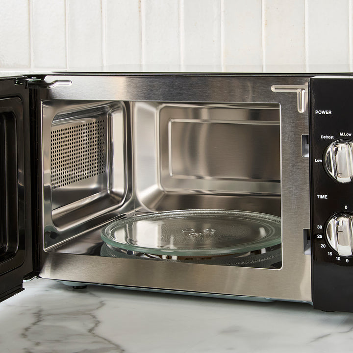 black microwave on kitchen counter
