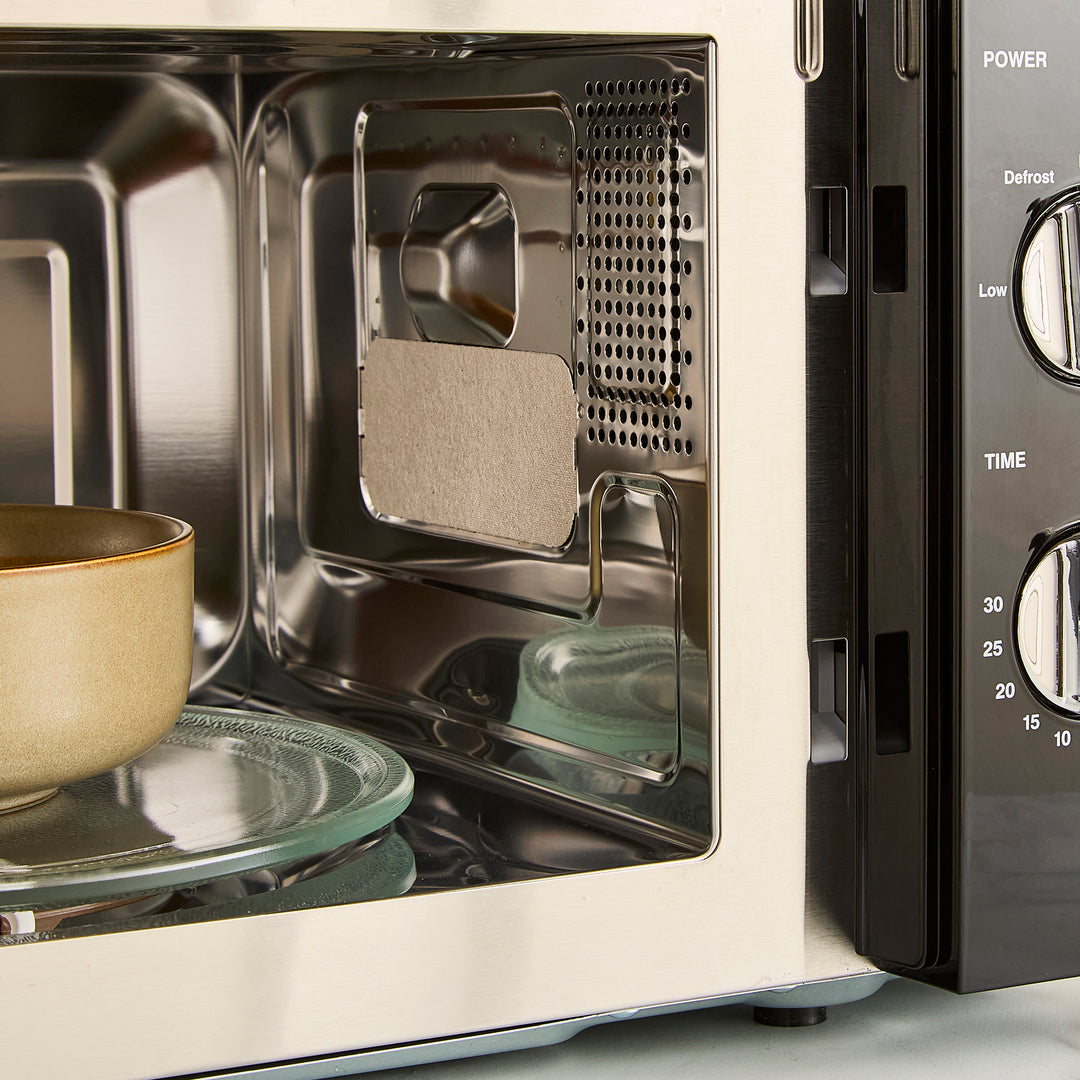 black microwave on kitchen counter