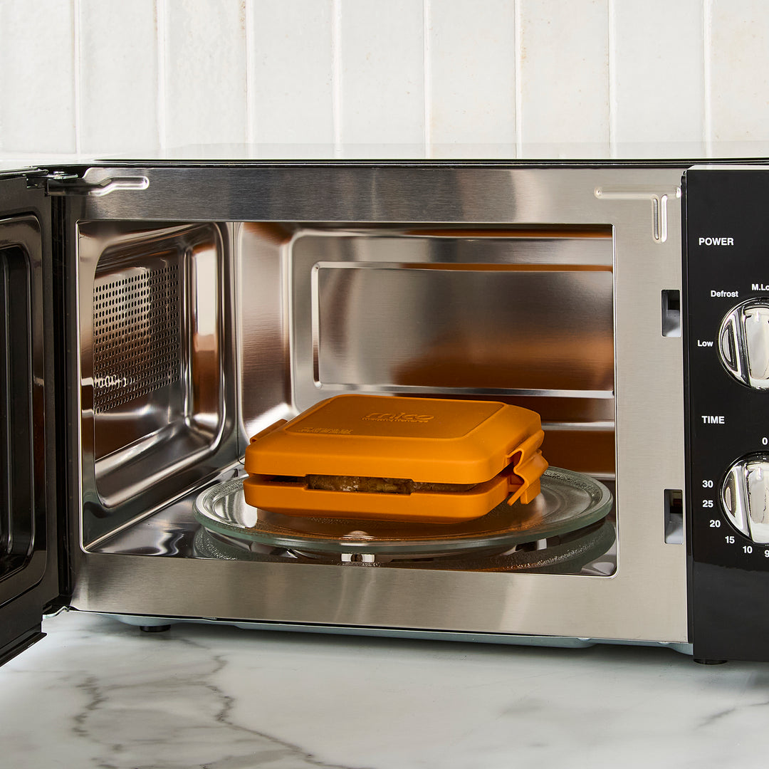black microwave on kitchen counter
