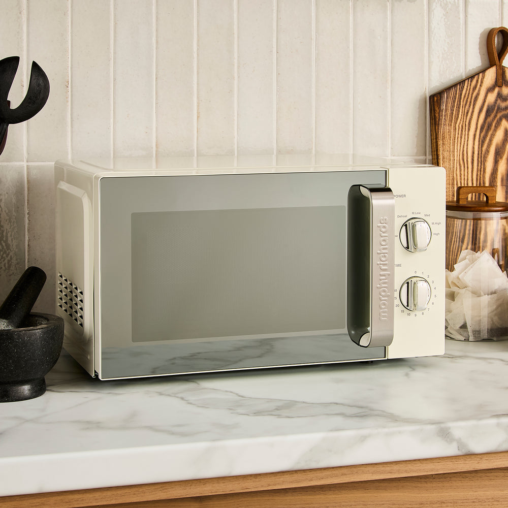 cream microwave on kitchen counter