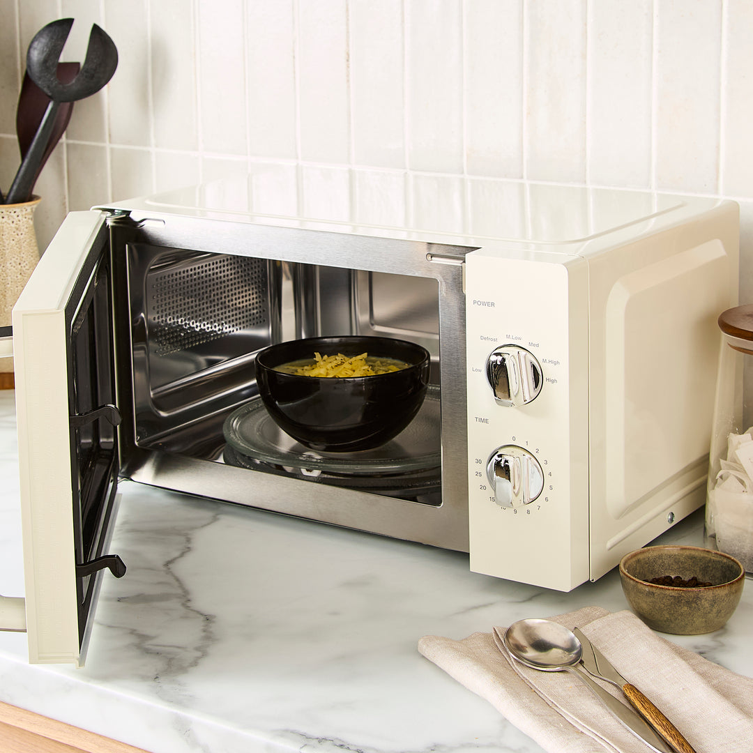 cream microwave on kitchen counter