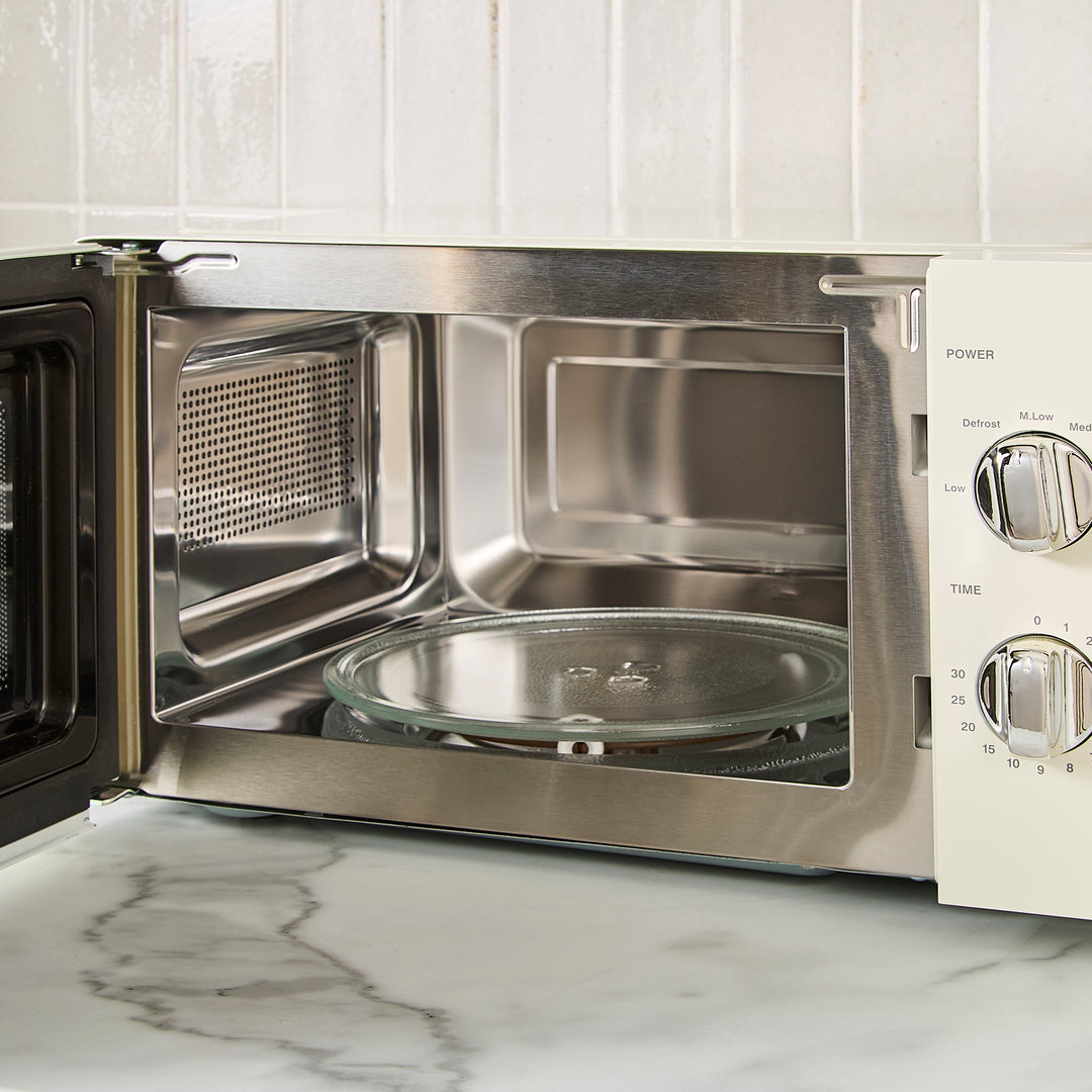 cream microwave on kitchen counter