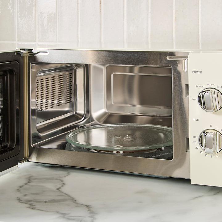 cream microwave on kitchen counter