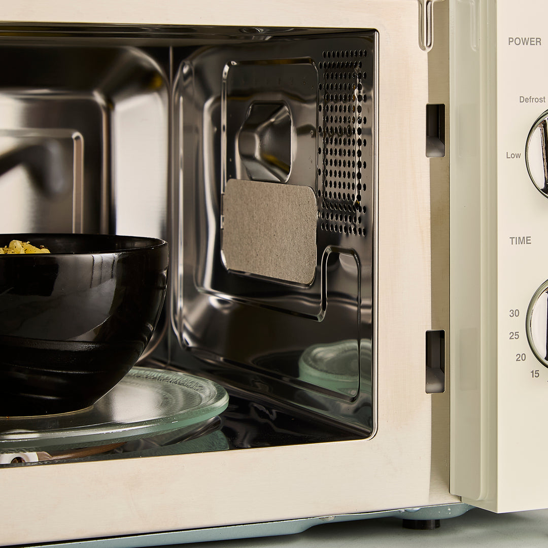 cream microwave on kitchen counter