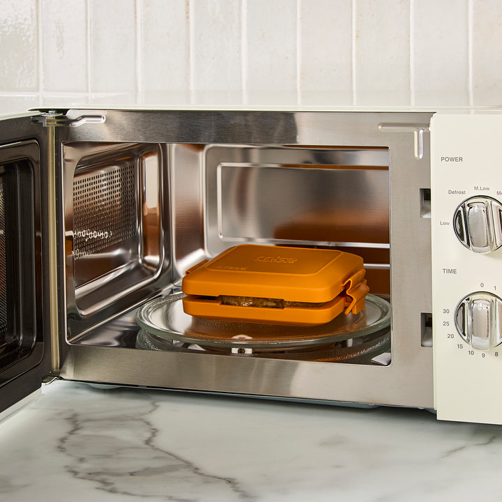 cream microwave on kitchen counter