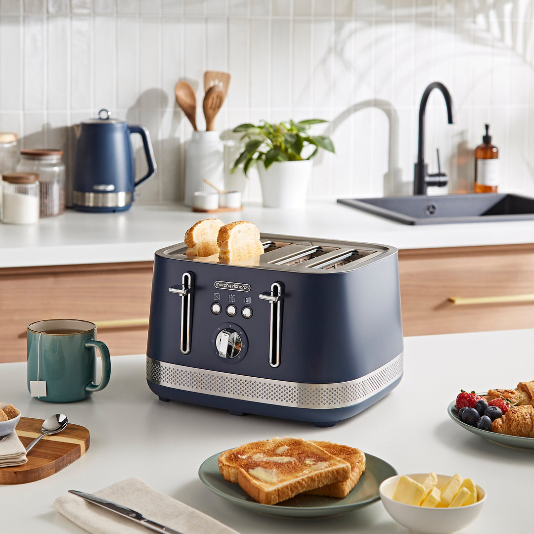 navy 4 slice toaster on kitchen counter with toast in front of it