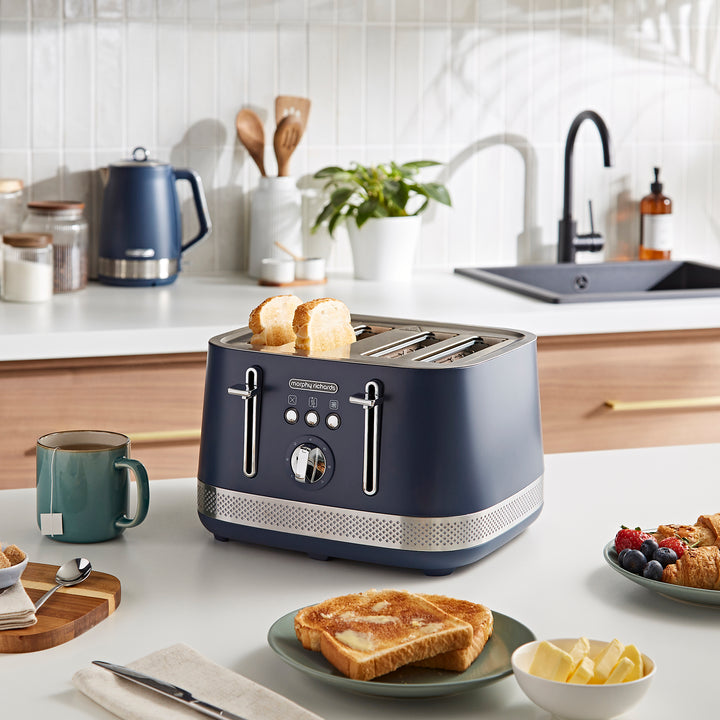 navy 4 slice toaster on kitchen counter with toast in front of it