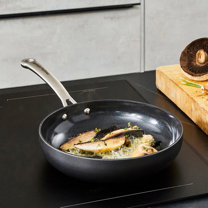 24cm Aluminium Non-Stick Frying Pan, frying mushrooms on an induction hob