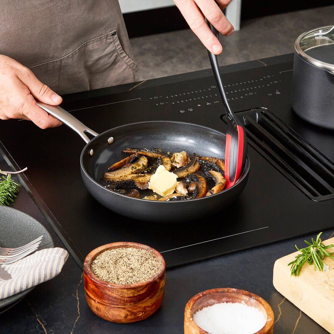 24cm Aluminium Non-Stick Frying Pan, frying mushrooms on an induction hob