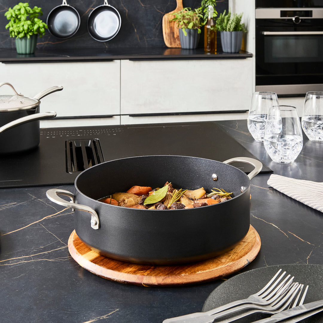 28cm Aluminium Non-Stick Shallow Casserole Dish on a granite countertop
