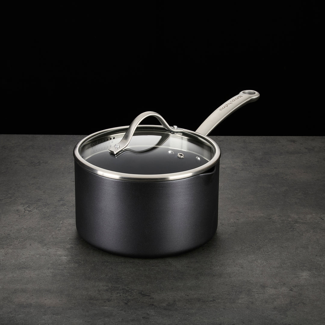 Saucepan with lid on granite countertop 