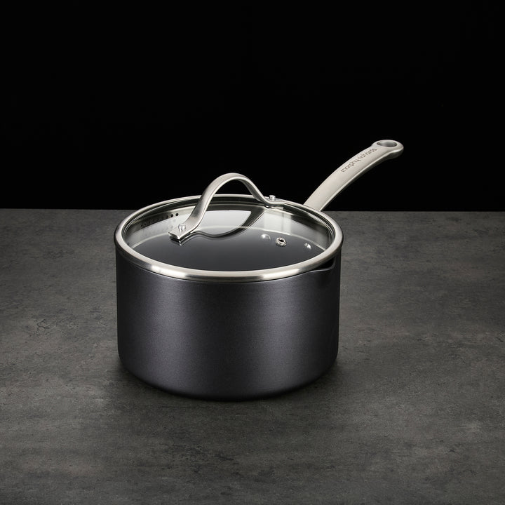 Saucepan with lid on granite countertop 