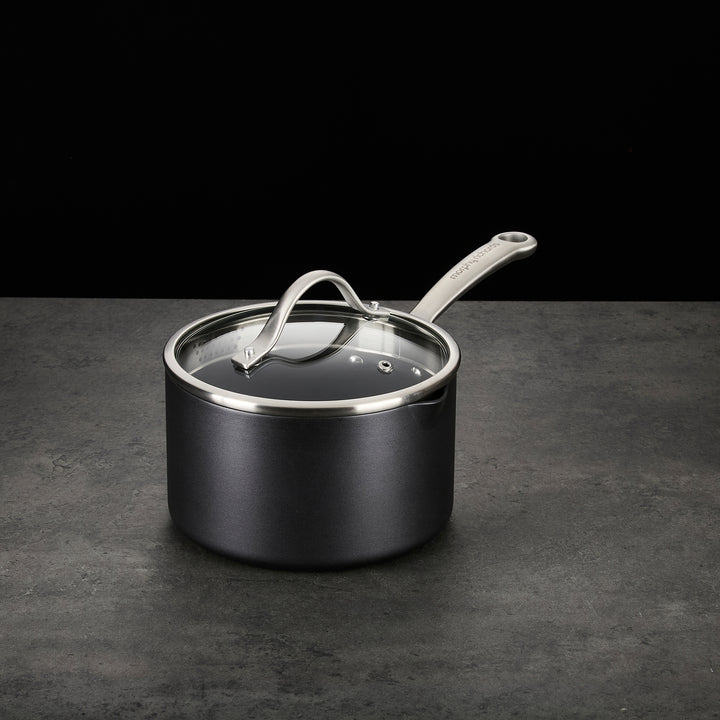 Saucepan with lid on granite countertop 