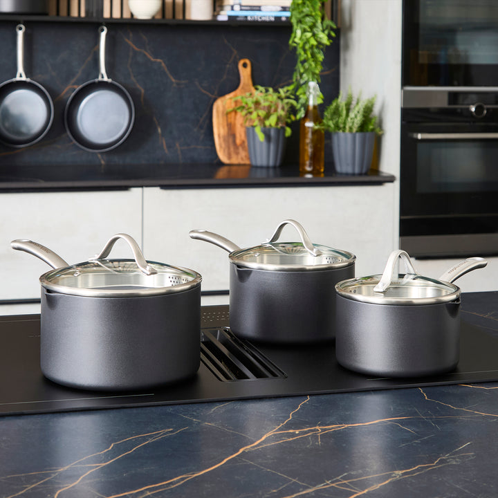 3 Piece Aluminium Non-Stick Pan Set on a granite countertop 