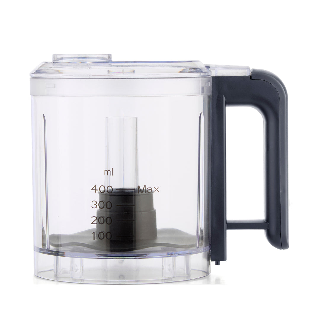 A clear plastic food processor bowl with a dark gray handle and base