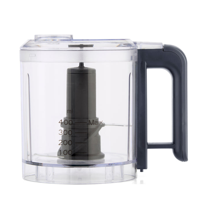 A clear plastic food processor bowl with a dark grey handle and central blade assembly, shown on a white background.