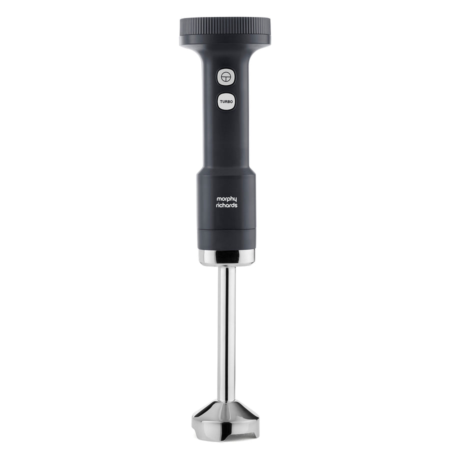 A modern hand blender with a dark gray handle and a silver metal rod and blade, shown against a plain white background. 